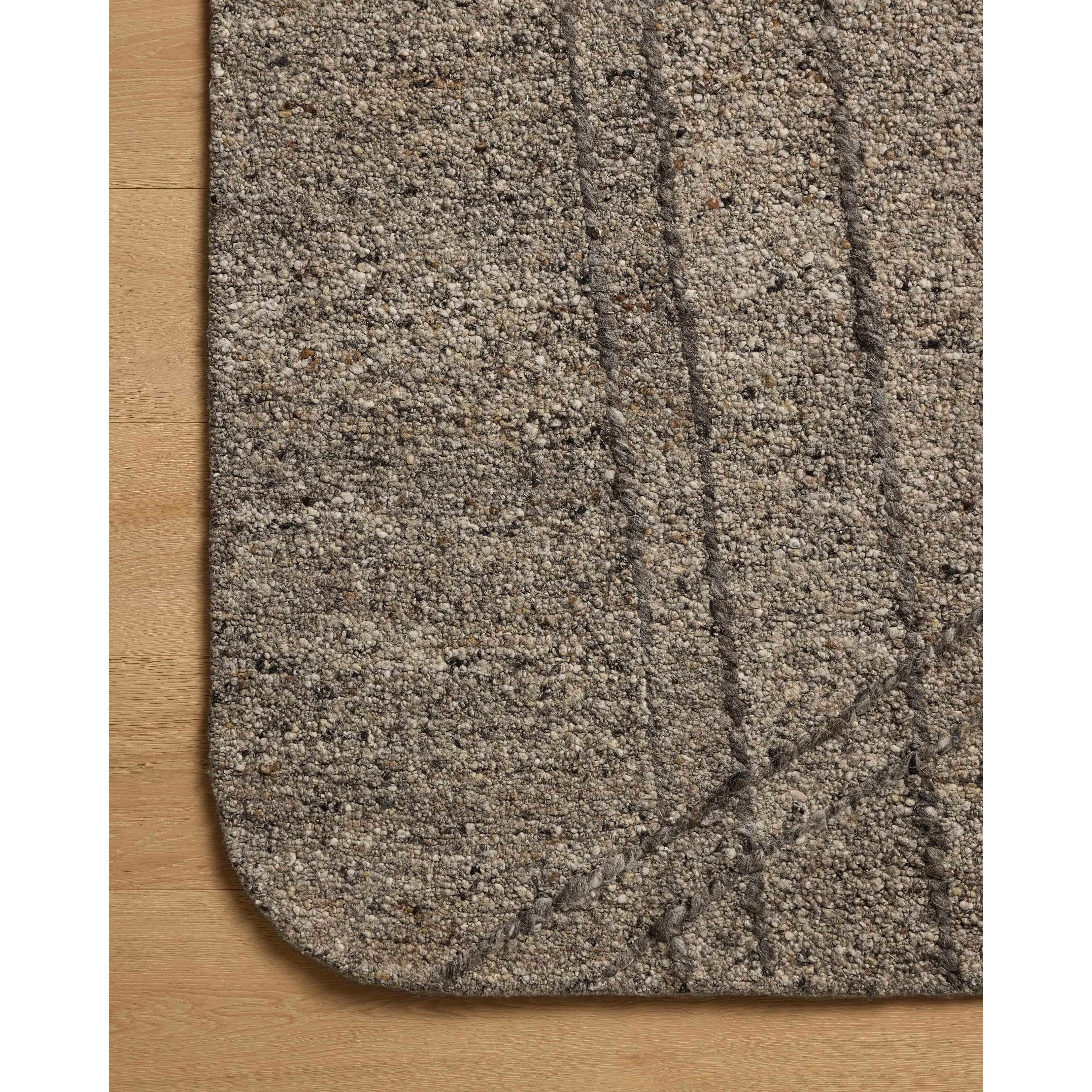 Featuring Otis Stone / Pebble Rug by Loloi at Amethyst Home. The Otis Collection is a hand-tufted area rug with an organic design and uniquely rounded edges. This design-forward collection features loose linear patterns in heathered, natural colors to ground living rooms, bedrooms, dining rooms, and more. This collection is hand-tufted of wool and other fi. Amethyst Home provides interior design, new home construction design consulting, vintage area rugs, and lighting in the Des Moines metro area.