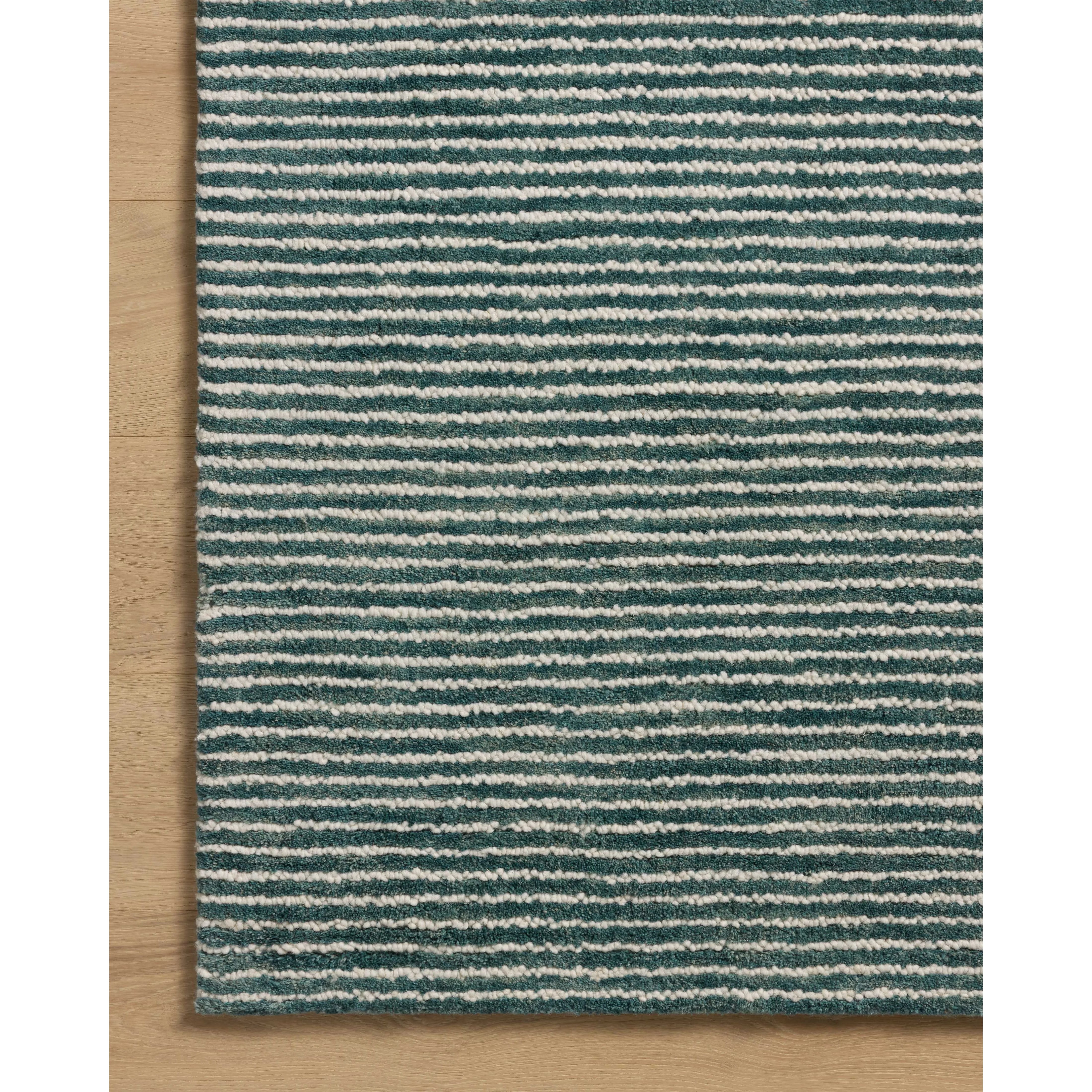 Featuring Sunday Ocean / Ivory Rug by Loloi at Amethyst Home. The Sunday Collection is a home-friendly, hand-tufted area rug with a pinstripe pattern in varied, vibrant tones. The rugs textured pile brings even more dimension and depth to this classic yet playful design. The Sunday Collection is hand-tufted of wool in India and Goodweave-certified, ensuri. Amethyst Home provides interior design, new home construction design consulting, vintage area rugs, and lighting in the Los Angeles metro area.