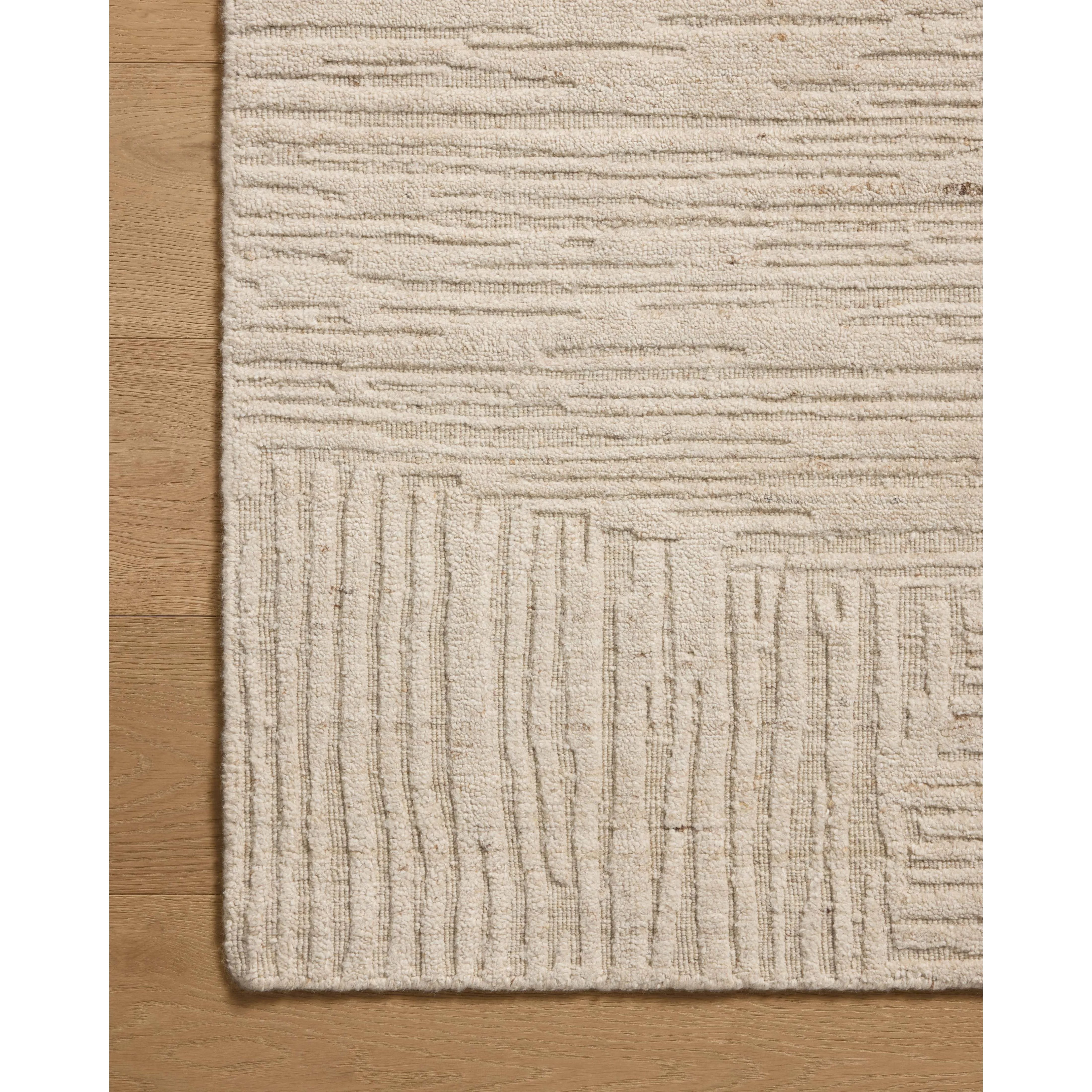 Featuring Woods Bone Rug by Loloi at Amethyst Home. The Woods Collection is a hand-woven area rug with a solid-colored, textured design for elevated home decor. It has a blended wool and rayon pile that is saturated with color and has a subtle sheen, a beautiful rug for living rooms, bedrooms, and more. This collection is made in India and Goodweave-certified. Amethyst Home provides interior design, new home construction design consulting, vintage area rugs, and lighting in the Houston metro area.