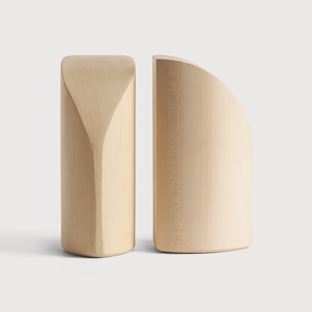 Featuring Pi Sycamore Book Ends by Ethnicraft at Amethyst Home. The PI collection honours nature’s design by keeping the strength, curves and lines, as nature intended. Each PI book end is finished by hand to ensure that the individual character of the wood is respected. Interesting shapes are discovered in this sleek and stylish, polished imperfect, finish. Designed by Alain van Hav. Amethyst Home provides interior design, new construction, custom furniture, and area rugs in the Boston metro area