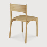 Featuring Pi Armless Oak Dining Chair by Ethnicraft at Amethyst Home. The PI collection honors nature’s design by keeping the strength, curves and lines, as nature intended. Interesting shapes are discovered in this sleek and stylish, polished imperfect, finish. Each PI item is finished by hand to ensure that the individual character of the wood is respected. The PI dining chair is t. Amethyst Home provides interior design, new construction, custom furniture, and area rugs in the Austin metro area
