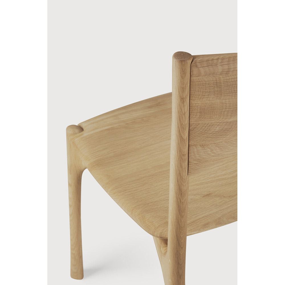 Featuring Pi Armless Oak Dining Chair by Ethnicraft at Amethyst Home. The PI collection honors nature’s design by keeping the strength, curves and lines, as nature intended. Interesting shapes are discovered in this sleek and stylish, polished imperfect, finish. Each PI item is finished by hand to ensure that the individual character of the wood is respected. The PI dining chair is. Amethyst Home provides interior design, new construction, custom furniture, and area rugs in the Monterey metro area