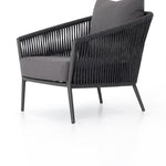 Featuring Porto Venao Charcoal Outdoor Chair by Four Hands at Amethyst Home. The perfect place for outdoor daydreaming. A beautiful rope-based design is woven across a durable aluminum frame in a rich bronze finish. Topped with a wide cushion and throw pillow, all upholstered in 100% olefin, known for its UV-resistant, water-repellent and quick-drying abilities. Cover or store indoors. Amethyst Home provides interior design, new construction, custom furniture, and area rugs in the Miami metro area
