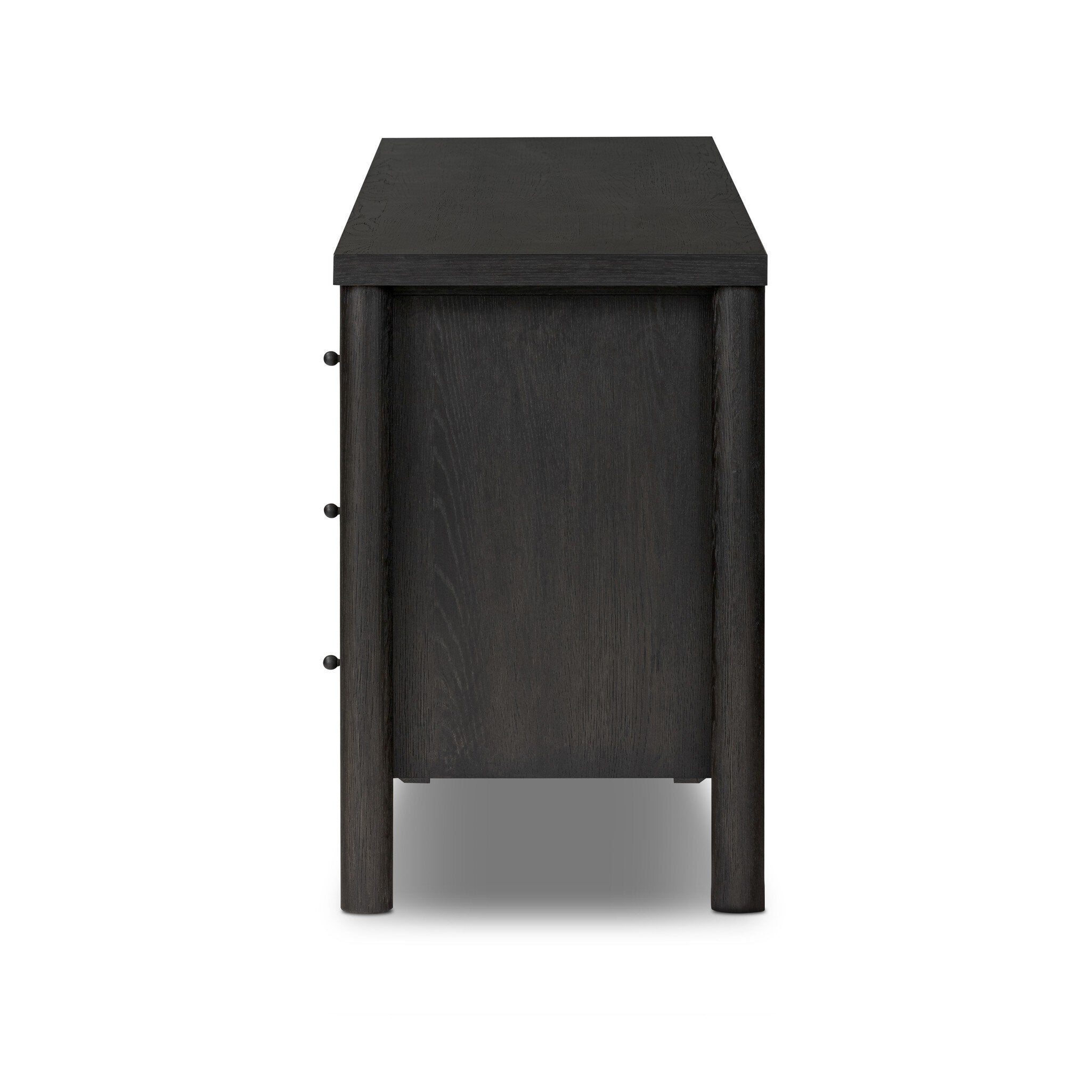 Featuring Roark Ebony Oak Veneer 6 Drawer Dresser by Four Hands at Amethyst Home. Rounded, chunky dowel legs in an ebony oak finish support the overhang top of this dresser. Six drawers provide ample storage, finished with simple gunmetal hardware.Overall Dimensions: 75.00"w x 20.00"d x 31.50"hWeight : 260.14 lbsMaterials : Oak Veneer, Solid Oak. Amethyst Home provides interior design, new construction, custom furniture, and area rugs in the Alpharetta metro area