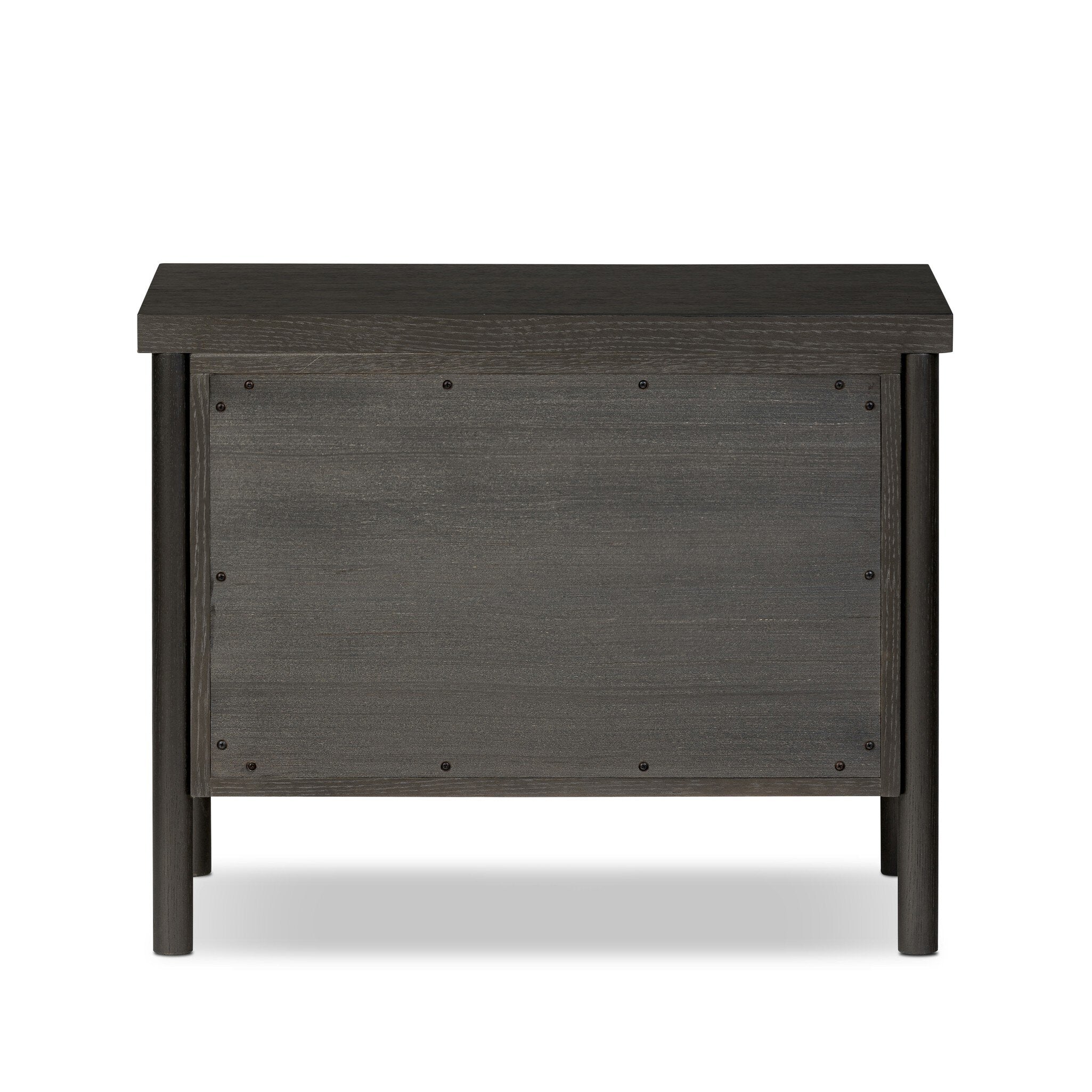 Featuring Roark Ebony Oak Veneer Nightstand by Four Hands at Amethyst Home. Rounded, chunky dowel legs in a black oak finish support the overhang top of this nightstand. Two drawers provide ample storage, finished with simple gunmetal hardware.Overall Dimensions: 30.00"w x 17.00"d x 24.00"hWeight : 76.06 lbsMaterials : Oak Veneer, Solid Oak. Amethyst Home provides interior design, new construction, custom furniture, and area rugs in the Winter Garden metro area