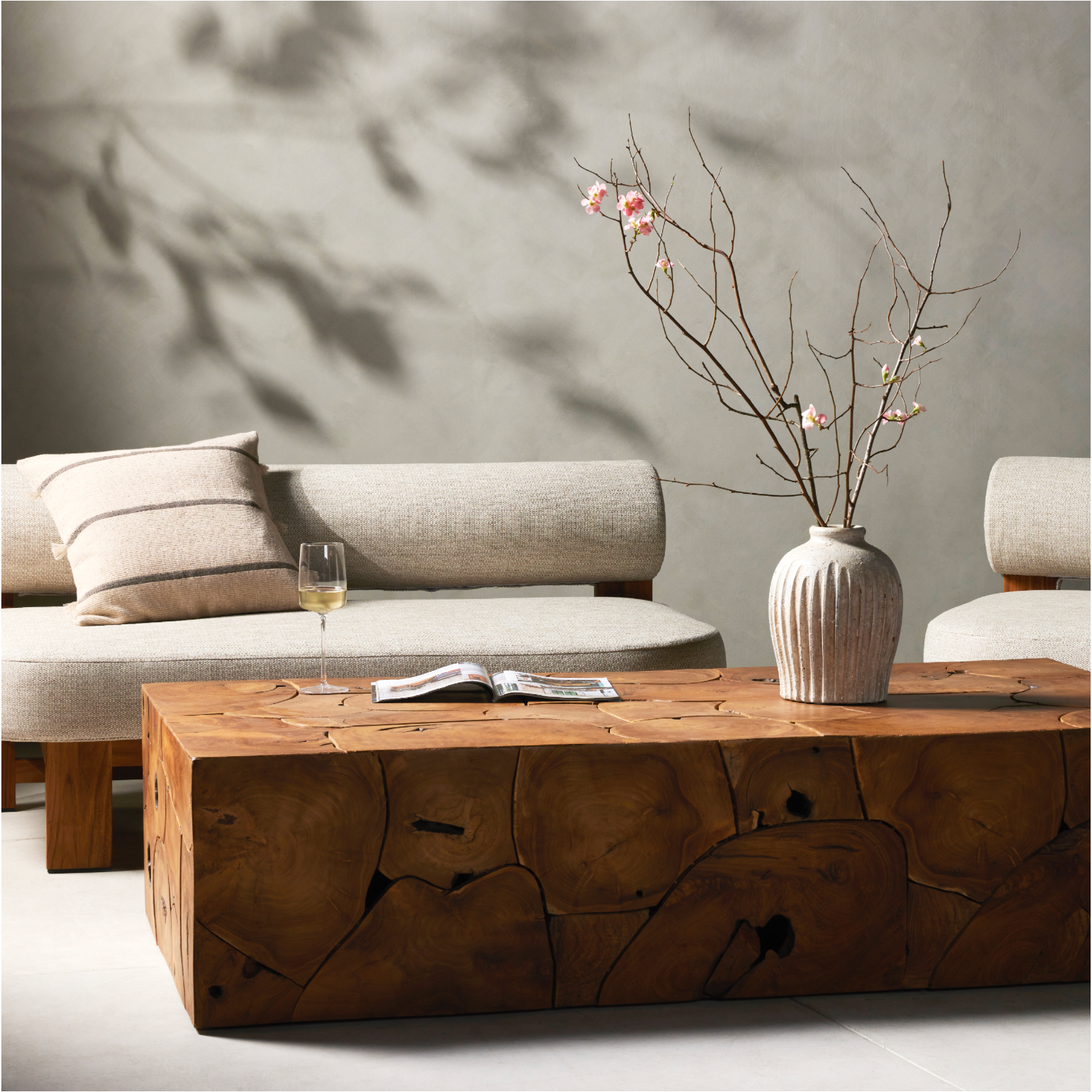 Featuring Tomlin Outdoor Coffee Table by Four Hands at Amethyst Home. A unique layering piece - indoors or out. Made from laminated teak root with miter joinery, a simply shaped coffee table offers organic vibes and plenty of natural movement. Tables will vary from piece to piece, reflective of natural materials. Joint expansion may grow visible over time. Cover or store indoors. Amethyst Home provides interior design, new construction, custom furniture and area rugs in the Laguna Beach metro area