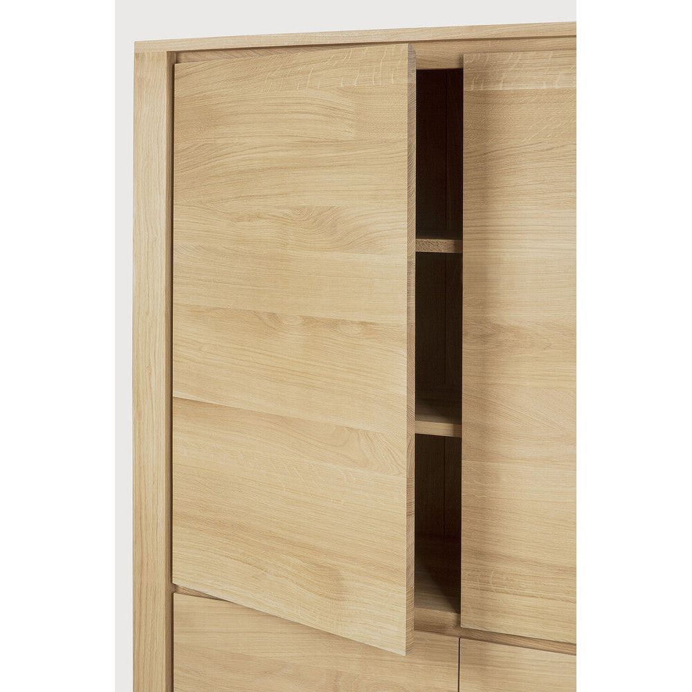 Featuring Shadow Oak Cupboard by Ethnicraft at Amethyst Home. Straightforward and robust with decisive lines, the Shadow storage cupboard with four doors is a simple yet impressive solution to your storage needs.Weight : 261 lbs Dimensions: 18" W x 45.5" L x 63" H. Amethyst Home provides interior design, new construction, custom furniture, and area rugs in the Seattle metro area