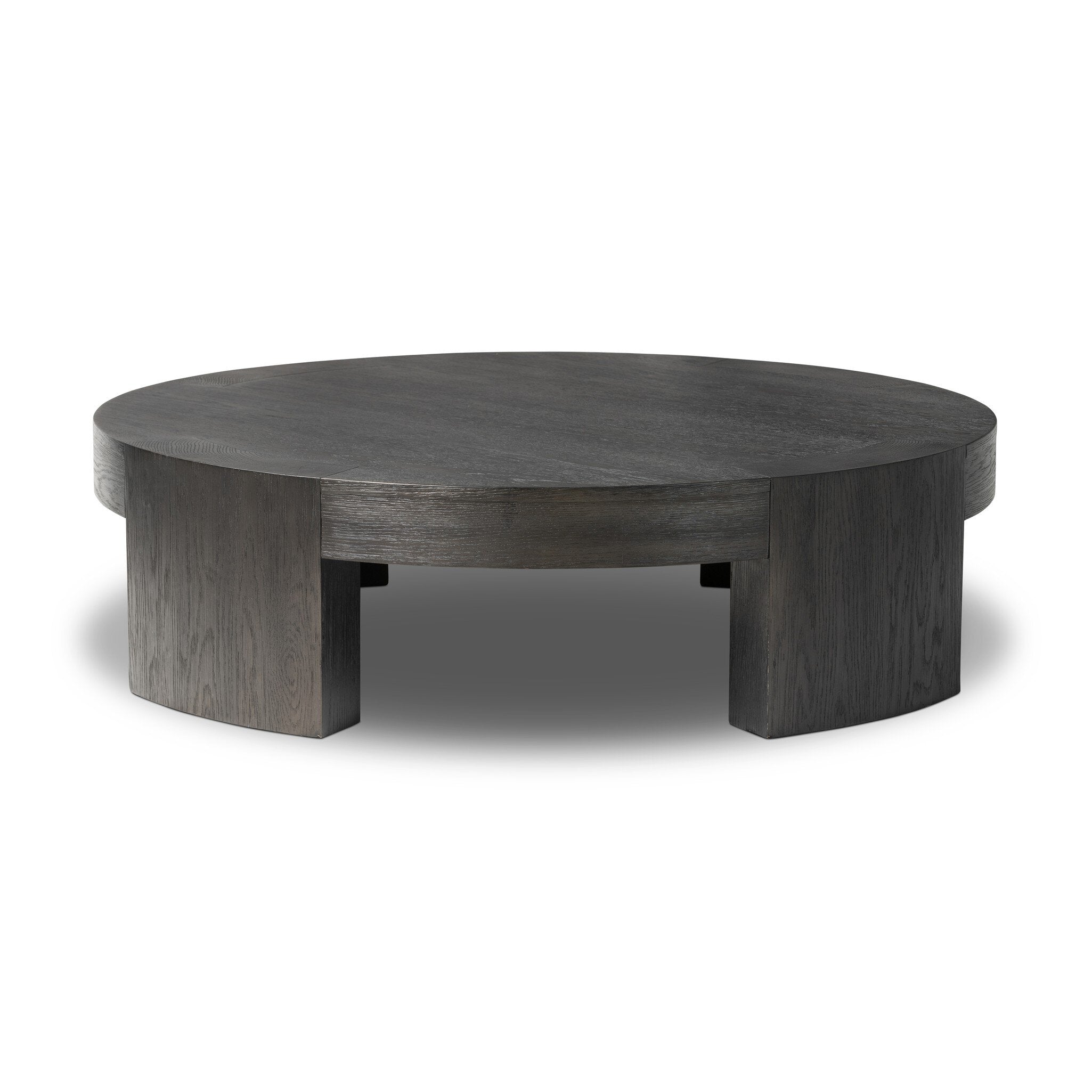 Featuring Sheffield Charcoal Oak Veneer Coffee Table by Four Hands at Amethyst Home. Made from thick, charcoal-finished oak, a rounded coffee table features four legs that pull through to the top, for an intriguing design detail.Overall Dimensions: 48.00"w x 48.00"d x 13.00"hWeight : 94.80 lbsMaterials : Oak Veneer. Amethyst Home provides interior design, new construction, custom furniture, and area rugs in the Charlotte metro area