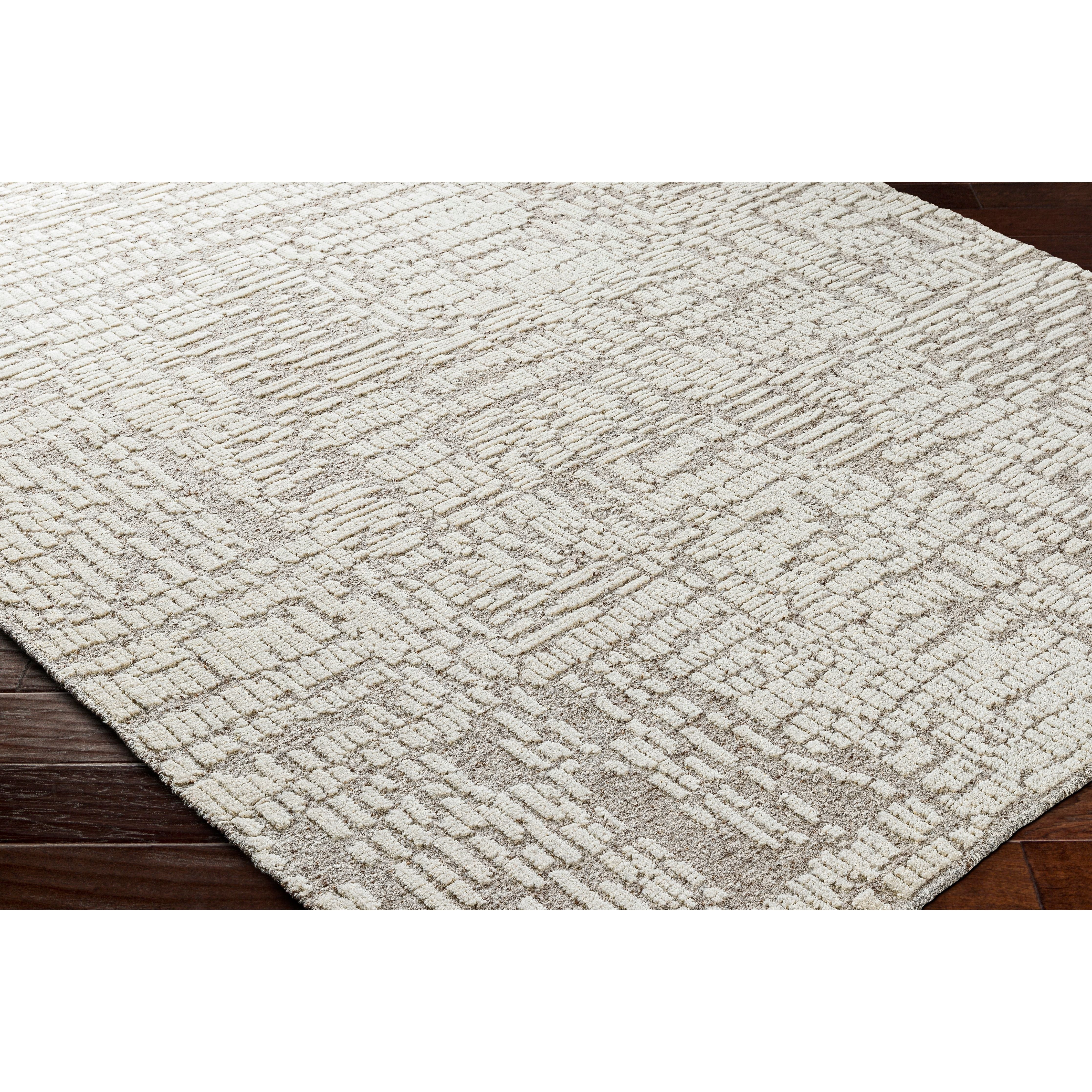 Featuring Tunus Aubrey Hand-Knotted Rug by Surya at Amethyst Home. Introducing the Tunus Aubrey rug, hand-knotted from 100% wool and woven into an abstract, geometric pattern. Featuring taupe and ivory colors, this stylish and warm rug brings modern sophistication to any space.
Hand-Knotted100% Wool
Clean spills immediately by blotting with a clean, dry sponge. Amethyst Home provides interior design, new home construction design consulting, vintage area rugs, and lighting in the Denver metro area.