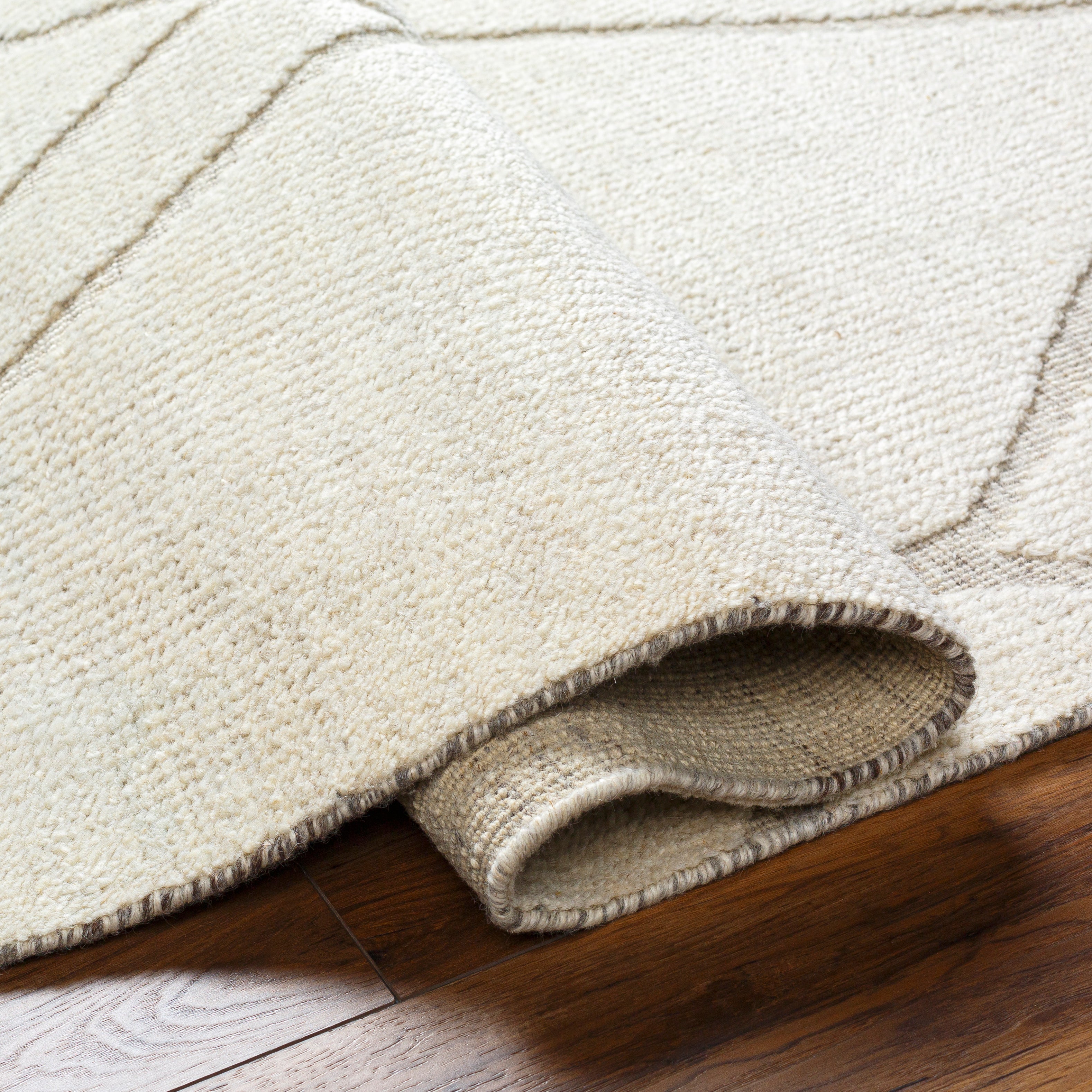 Featuring Tunus Cream Hand-Knotted Rug by Surya at Amethyst Home. The Tunus Cream Rug features a globally inspired design made from New Zealand wool. The hand-knotted rug adds wabi sabi charm to any room.
Hand-Knotted100% Wool
Clean spills immediately by blotting with a clean, dry sponge or cloth. Professional cleaning recommended. Appropriate rug pad is highl. Amethyst Home provides interior design, new home construction design consulting, vintage area rugs, and lighting in the Denver metro area.