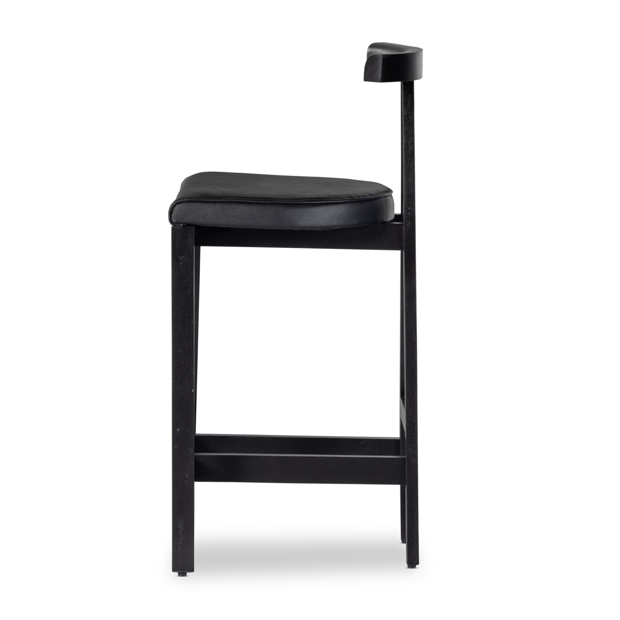 Featuring Tex Black Leather Counter Stool by Four Hands at Amethyst Home. This dark, monochromatic look inspired by Greek design meets black-finished Rosa Morada with black top-grain leather. A slim T-shape frame is perfectly sized for the counter.Overall Dimensions: 20.25"w x 17.75"d x 36.50"hWeight : 11.90 lbsMaterials : Top Grain Leather, Solid Rosa Morada, 100% Polyurethane. Amethyst Home provides interior design, new construction, custom furniture, and area rugs in the Laguna Beach metro area