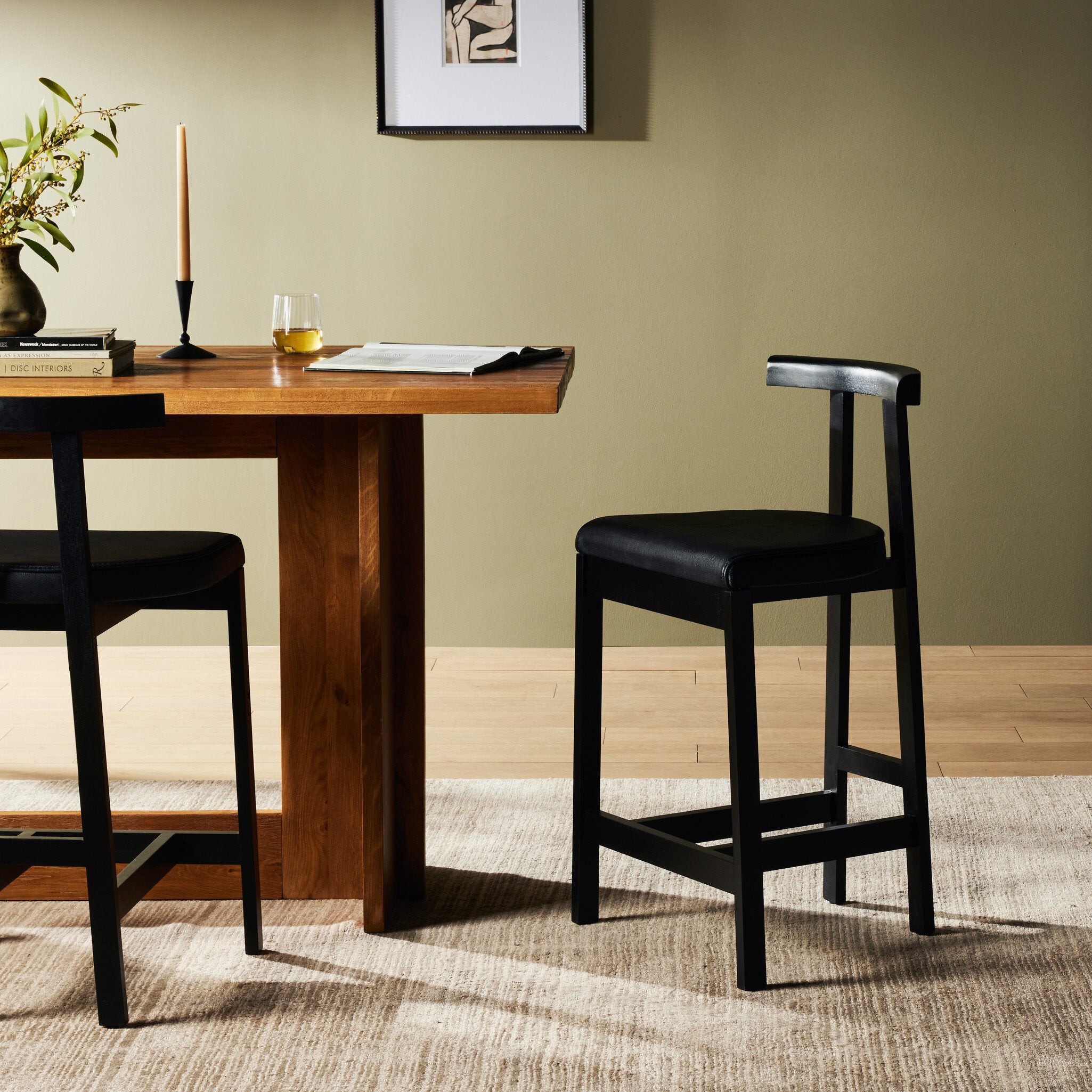 Featuring Tex Black Leather Counter Stool by Four Hands at Amethyst Home. This dark, monochromatic look inspired by Greek design meets black-finished Rosa Morada with black top-grain leather. A slim T-shape frame is perfectly sized for the counter.Overall Dimensions: 20.25"w x 17.75"d x 36.50"hWeight : 11.90 lbsMaterials : Top Grain Leather, Solid Rosa Morada, 100% Polyurethane Foam. Amethyst Home provides interior design, new construction, custom furniture, and area rugs in the Omaha metro area