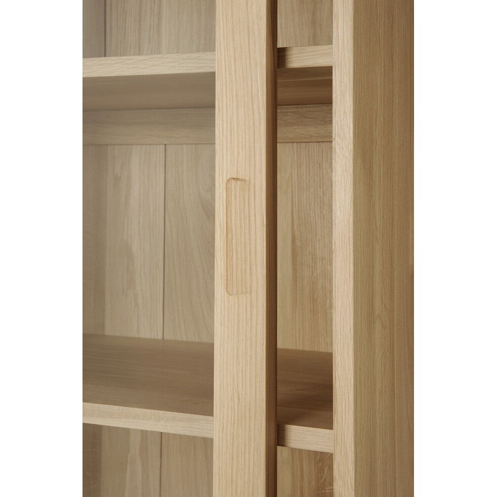 Featuring Wave Oak Cupboard by Ethnicraft at Amethyst Home. The subtle contours of the cabinet doors and the distinguished shape of the feet are what make the Wave collection so special. Made of solid wood, this storage cupboard’s doors and drawers have no handles and feature a soft closing mechanism.Weight : 256 lbs Dimensions: 18.5" W x 43.5" L x 72.5" H. Amethyst Home provides interior design, new construction, custom furniture, and area rugs in the Omaha metro area