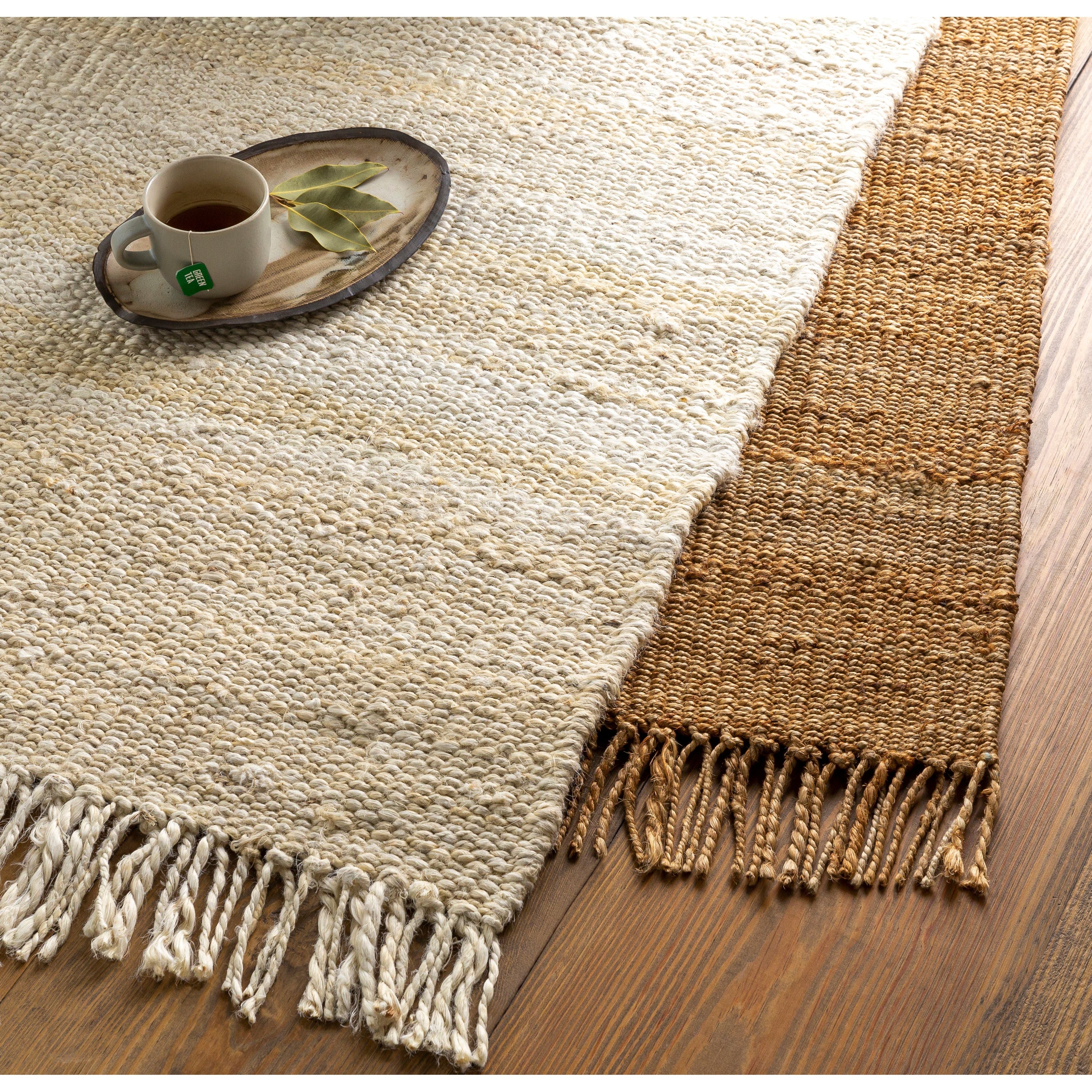 Featuring Vienne Bleached Jute Rug with Fringe by Surya at Amethyst Home. Hand-woven of natural jute, this Vienne rug adds a calming, grounding presence to every space.  We love its chunky texture under foot and it's carefree fringe for a stress-free look.
Hand-wovenNatural jute.  Amethyst Home provides interior design, new home construction design consulting, vintage area rugs, and lighting in the Kansas City metro area.