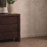 Made from solid acacia and finished in a rustic brown, a six-drawer, waterfall-shaped dresser features soft volume, mitered corners and a faux live edge.Overall Dimensions: 69.50"w x 20.00"d x 35.25"hWeight : 278.22 lbsMaterials : Solid Acacia Amethyst Home provides interior design, new home construction design consulting, vintage area rugs, and lighting in the Park City metro area.