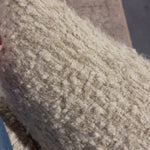 A modern take on a 70s-inspired shape. This sink-in, pillow-like chair features S-spring suspension for extra comfort and durability in the seat, all on a 360-degree swivel. Upholstered in an exaggerated boucle fabric with extra depth and texture throughout. Amethyst Home provides interior design, new home construction design consulting, vintage area rugs, and lighting in the Scottsdale metro area.