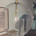 A single glass sphere dangles for a stunning effect. Each globe is individually blown, shaped and sculpted by hand through a one-hour process. Brass and glass are 98% recyclable. Designed and sustainably crafted in Poland by Schwung. Amethyst Home provides interior design, new home construction design consulting, vintage area rugs, and lighting in the Des Moines metro area.