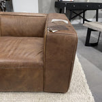 The Bolton Sofa's top-grain leather and minimalistic design combine to make a great first impression. With an ample seating area that will comfortably fit four people, this top-grain leather sofa is perfect for catching up with friends or on some much-needed sleep.  Size: 101"W x 44.5"D x 27.5"H