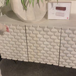 We love the texture of this Rio Media Console - Round Cut White Wash. Made from solid mango with spacious interior shelving and a rear cutout for card management, this is a beautiful piece to add to any living room or entertainment area.   Overall Dimensions: 82.00"w x 18.25"d x 28.00"h