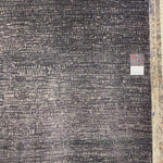 The Atlas Black / Bark Area Rug by Loloi, or ATL-05, showcases striking contemporary patterns with a sophisticated color palette. Bold yet approachable, Atlas' muted linear designs create a sense of refined movement. Hand Knotted. Wool | Nylon