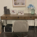 Inspired by clean mid-century design, grey-ish auburn poplar offers plenty of desk storage by way of three spacious drawers. Metal-secured leather pulls add a textural element of surprise. Great solo or paired with matching corner desk, file cabinet or credenza.  Size: 59.75"w x 22"d x 31.25"h