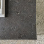 Spare beauty, casual elegance with the Harlow Bluestone Small Coffee Table. A gunmetal Parson's base with hand-rubbed, dimensional edges supports a rough-hewn bluestone slab that feels found and perfectly placed.  Size: 60"w x 28"d x 17"h