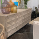 We love the textures found on this Montero Sideboard.  A wash of white and a light distressing add a whisper of color and texture to enhance this striking sideboard’s finish.   RECYCLED PINE ON IRON BASE GREY WHITE WASH FINISH Size: 84"l x 19"d x 37"h