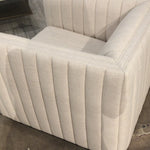 You will love the dramatic channeling of this Augustine Cream Swivel Chair. The swivel feature sets this apart from other chairs and is a great choice for any living room or media room. This chair is comfort wrapped in soft linen blend making this everyone's favorite chair.  Overall Dimensions: 32.00"w x 34.00"d x 26.50"h