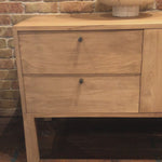 This Isador Nightstand - Dry Wash Poplar is clean, bright and dreamy. Solid dry-washed poplar forms a clean-lined media console with dovetail joinery plus iron and leather hardware, for a fresh look to any living room.  Ample shelving + rear cut outs for cord management brings this to the next level!  Overall Dimensions: 80.00"w x 19.00"d x 26.00"h