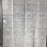 Hand-knotted in India of 100% wool, the Amara Ivory/Taupe Area Rug creates a casual yet refined vibe with high-end appeal. With shades of ivory, taupe, and black, this is a gorgeous rug to showcase in your living room, entryway, bedroom, or other high traffic area.   Hand Knotted 100% Wool AMM-04 Ivory/Taupe