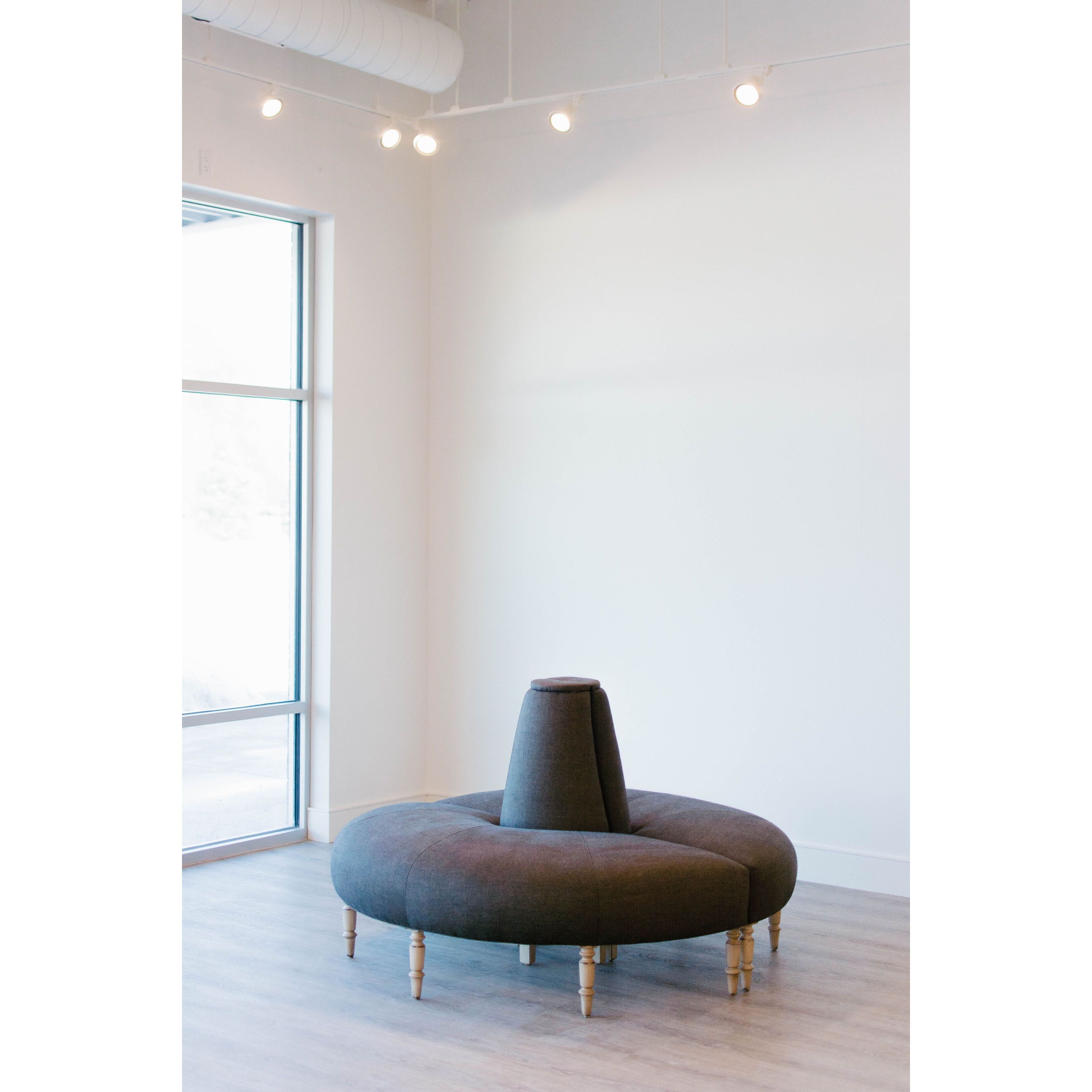 Featuring JD Coin 2 Piece Upholstered Sofa by Cisco Brothers at Amethyst Home. In a beautiful natural linen, this 360 degree coin sofa is an elegant statement in a foyer, striking in a master closet, or a perfect transition in living spaces. This coin sofa ships in two pieces for easy installation and comes with clips to secure the piece as one. Or, for a ve. Amethyst Home provides interior design, new home construction design consulting, vintage area rugs, and lighting in the Houston metro area.