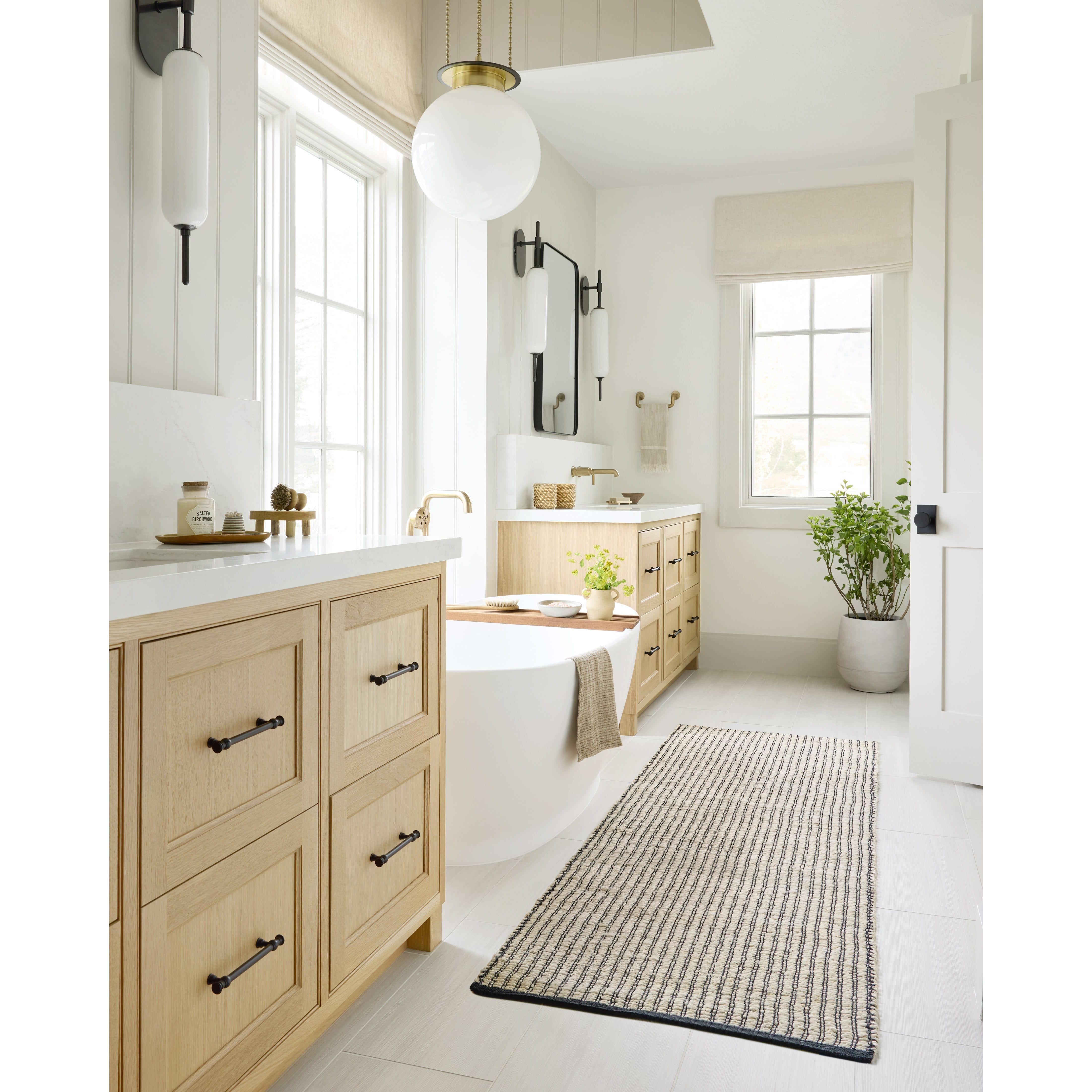 Featuring Angela Rose x Loloi Colton Ivory / Black Rug by Loloi at Amethyst Home. The Angela Rose x Loloi Colton Ivory / Black rug is a new take on the staple jute rug, blended with cotton for added softness. In a range of linear designs in modern earth tones, Colton can add visual interest to a room or serve as a gently textured neutral. This collection is hand-woven in India and GoodWeave. Amethyst Home provides interior design services, furniture, rugs, and lighting in the Nashville metro area.