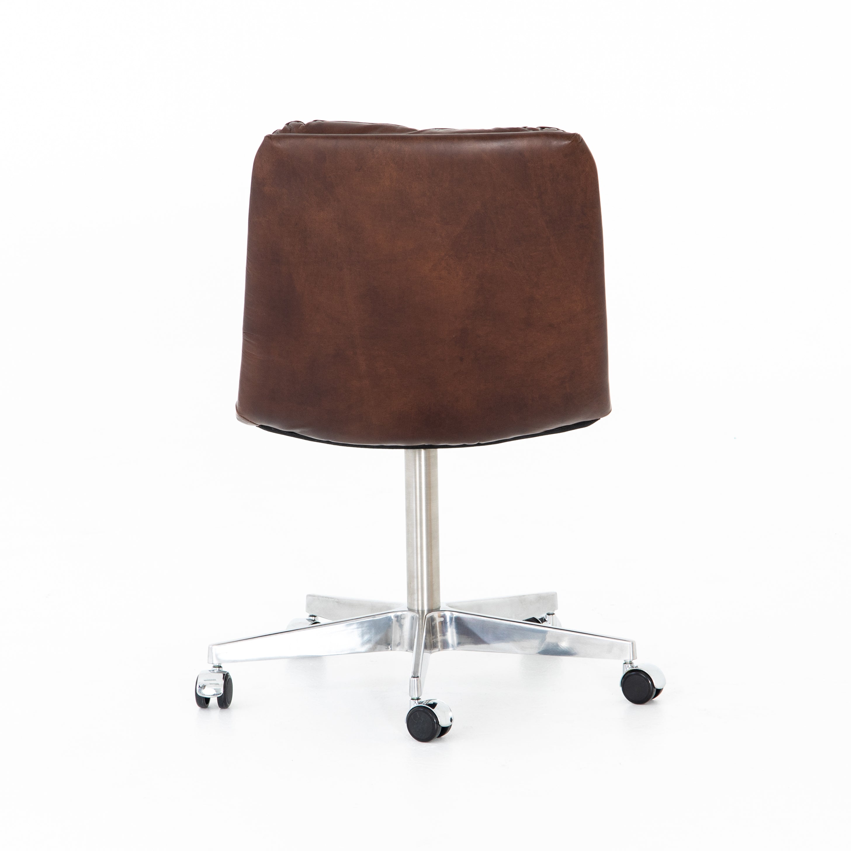 Featuring Malibu Desk Chair - Antique Whiskey by Four Hands at Amethyst Home. Paired back and fashion-forward, this minimalist desk chair in a dark chestnut top-grain leather offers maximum comfort. Inspired by workspaces of the ‘50s and ‘60s. Stainless steel casters make for stylish ease in the workplace. Height not adjustable.
Overall Dimensions: 20.75"W x 2.  Amethyst Home provides interior design, new home construction design consulting, vintage area rugs, and lighting in the Tampa metro area.