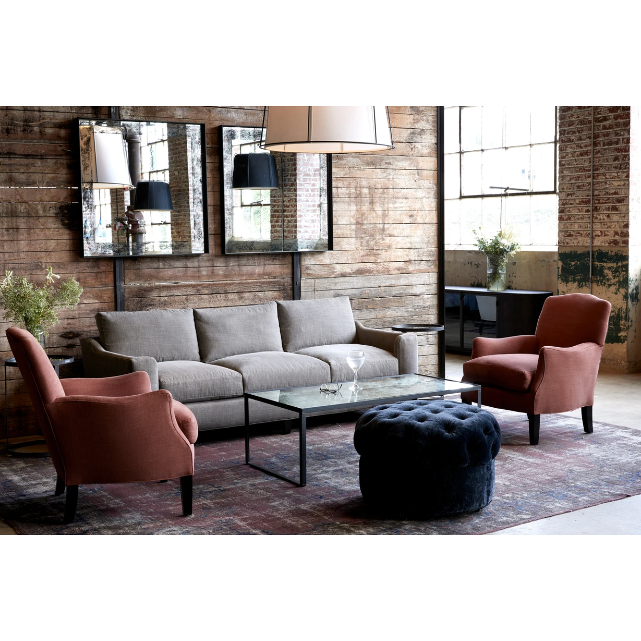 Featuring Gunner Upholstered 84" Sofa by Cisco Brothers at Amethyst Home. A chic, yet simple design, the Gunner Upholstered Sofa by Cisco Brothers boasts a streamlined frame supported by tapered legs. This sofa is beautifully detailed, with piping on the body and top stitch on cushions. It has a traditional yet sleek look, ideal for entertaining. Photographe. Amethyst Home provides interior design, new home construction design consulting, vintage area rugs, and lighting in the Austin metro area.