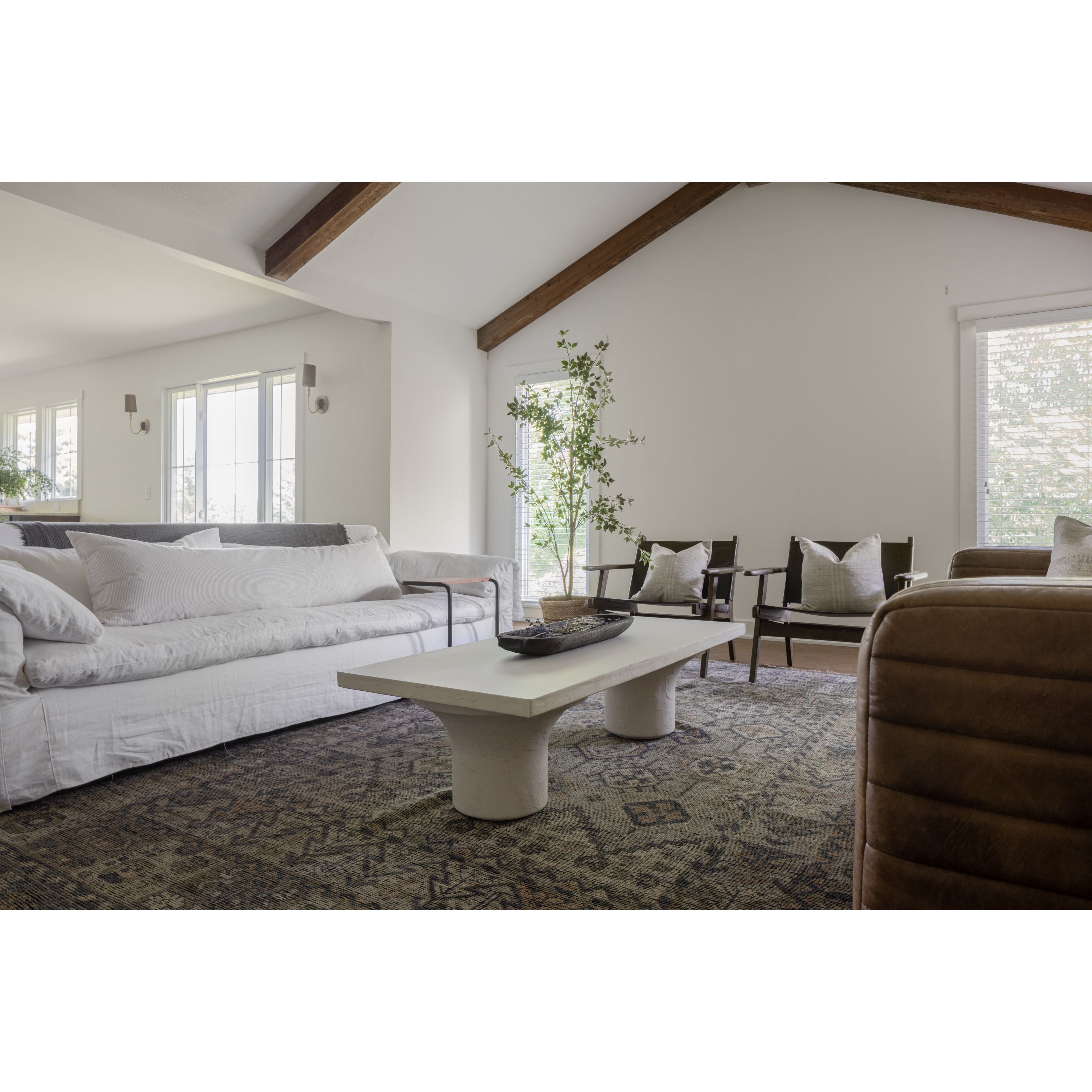 Featuring Parra Coffee Table - Plaster Molded Concrete by Four Hands at Amethyst Home. Make a monolithic statement with this Parra Coffee Table - Plaster Molded Concrete. Made from plaster-molded concrete, the pedestal-style legs support a rectangular tabletop of smooth, white-finished concrete, for a clean, adobe-inspired look.
Overall Dimensions: 59.75"W x . Amethyst Home provides interior design, new home construction design consulting, vintage area rugs, and lighting in the Houston metro area.