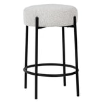 Featuring Becca Counter Stool by Dovetail at Amethyst Home. Striking modern exposed frame paired with a dreamy textural boucle fabric.  Comfortable and lean to fit as many stools as possible!  Simply spot clean with soap and water or soak stubborn spills with hydrogen peroxide.
26"h x 18"d x 18"wFinish : Oatmeal Upholstery with Black Metal Legs. Amethyst Home provides interior design, new home construction design consulting, vintage area rugs, and lighting in the Seattle metro area.
