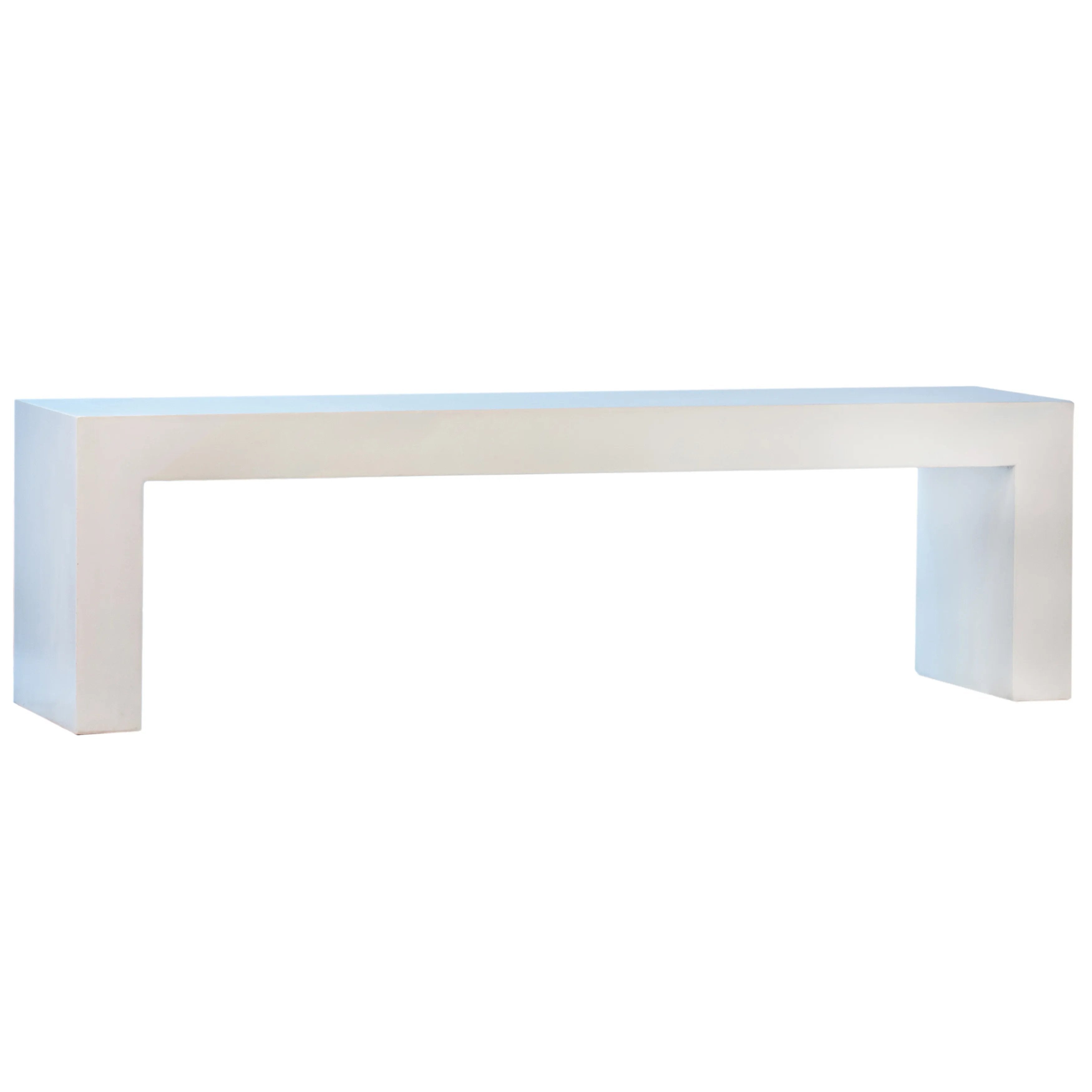 Featuring White Concrete Bench by Dovetail at Amethyst Home. Suitable for both indoor and outdoor settings, this modern bench features a beautiful waterfall design. Naturally attractive and durable, measuring 63” in length, it is constructed with reinforced concrete. Featuring a white sealed finish, this three-seater bench is fresh and contemporary. Ideal a. Amethyst Home provides interior design, new home construction design consulting, vintage area rugs, and lighting in the San Diego metro area.
