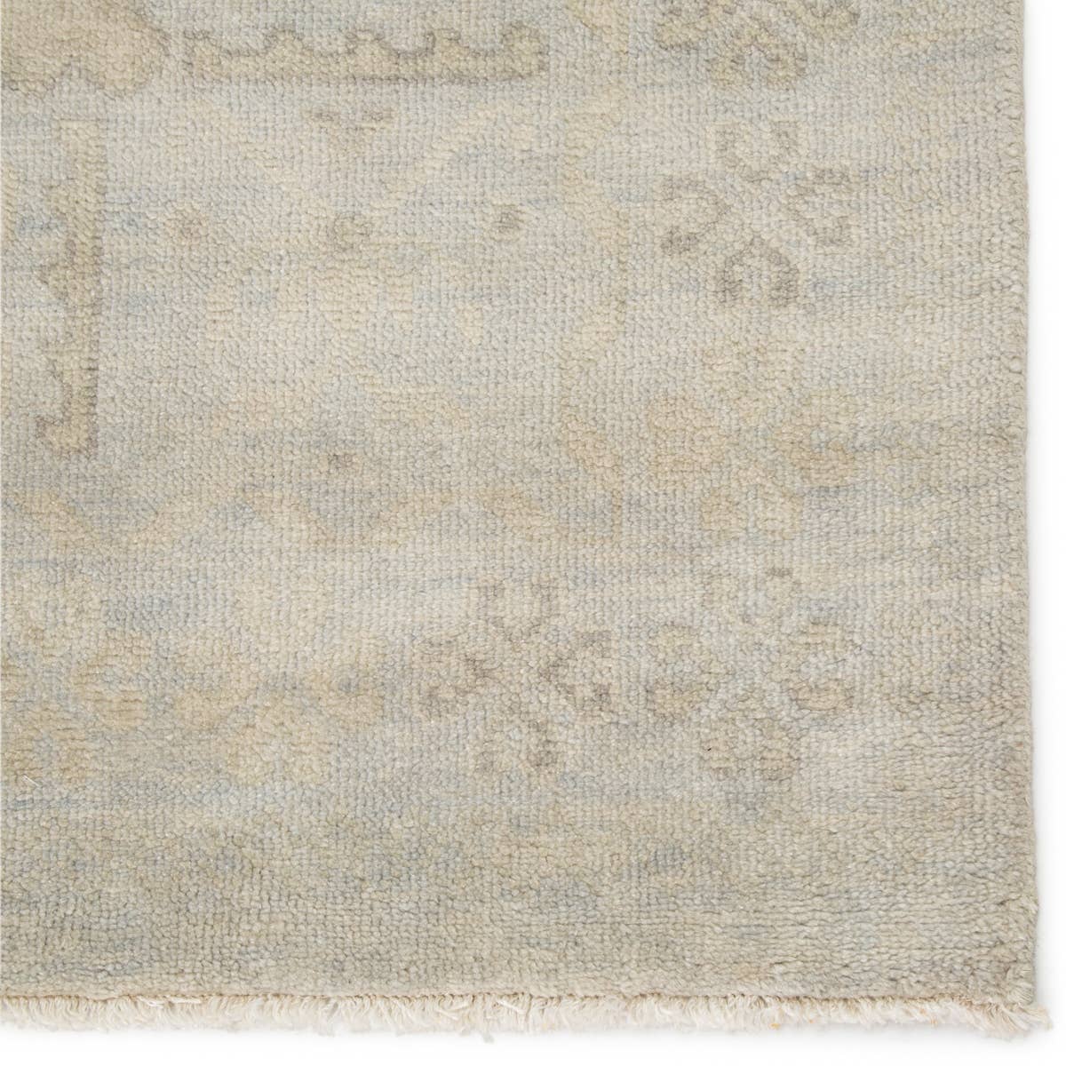 Featuring Eloquent Chival Hand-Knotted Rug by Jaipur Living at Amethyst Home. The Eloquent Chival Area Rug emanates traditional elegance, lending a soft and serene look to transitional homes. The Chival area rug features a washed vintage-inspired design in muted gray and beige tones. This hand-knotted wool rug grounds living spaces with a classic, stately look.  Amethyst Home provides interior design, new home construction design consulting, vintage area rugs, and lighting in the Omaha metro area.