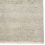 Featuring Eloquent Chival Hand-Knotted Rug by Jaipur Living at Amethyst Home. The Eloquent Chival Area Rug emanates traditional elegance, lending a soft and serene look to transitional homes. The Chival area rug features a washed vintage-inspired design in muted gray and beige tones. This hand-knotted wool rug grounds living spaces with a classic, stately look.  Amethyst Home provides interior design, new home construction design consulting, vintage area rugs, and lighting in the Omaha metro area.