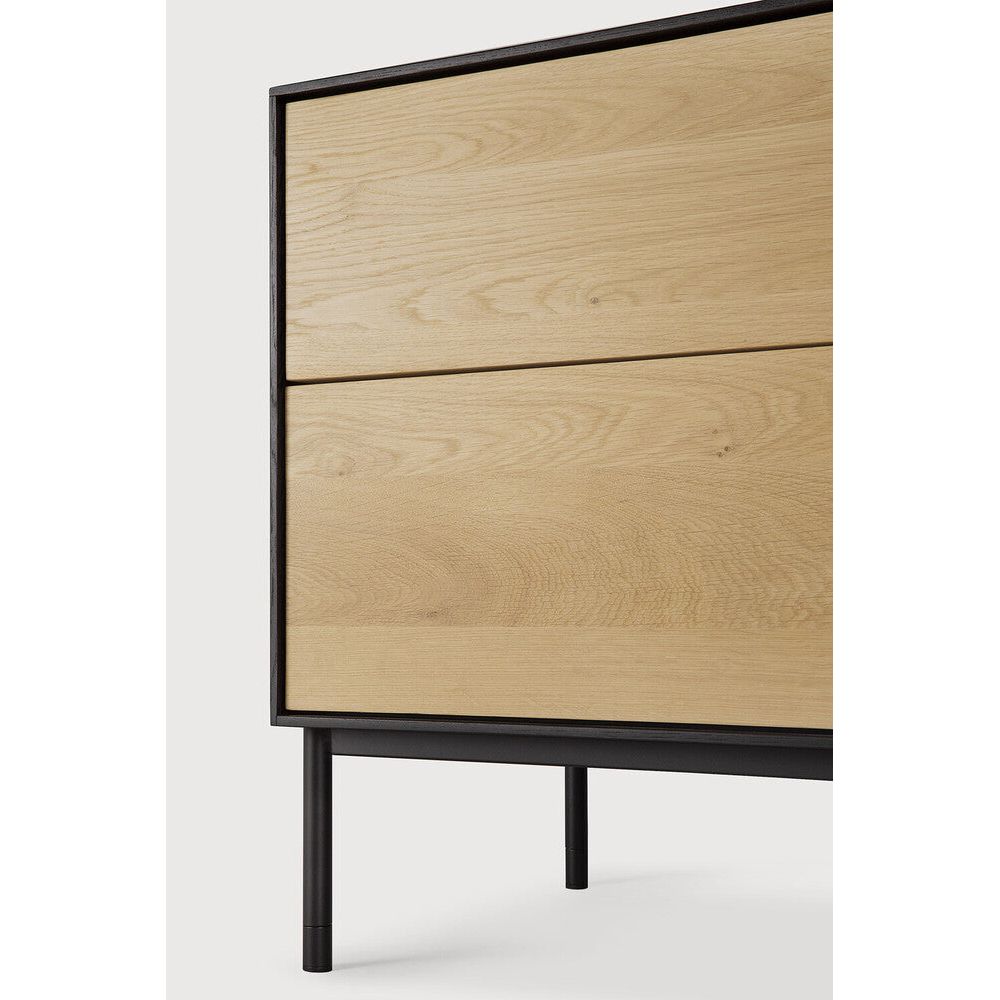 Featuring Blackbird TV Cupboard Oak by Ethnicraft at Amethyst Home. For our Blackbird collection, designer Alain van Havre brings together opposing elements, combining soft round legs and eye-catching graphic lines into light and airy designs.
Dimensions: 18"d x 71"w x 24.5"h
Anti-tipping mechanism : YesBrushed : This finishing gives our furniture more depth. T. Amethyst Home provides interior design, new home construction design consulting, vintage area rugs, and lighting in the Tampa metro area.
