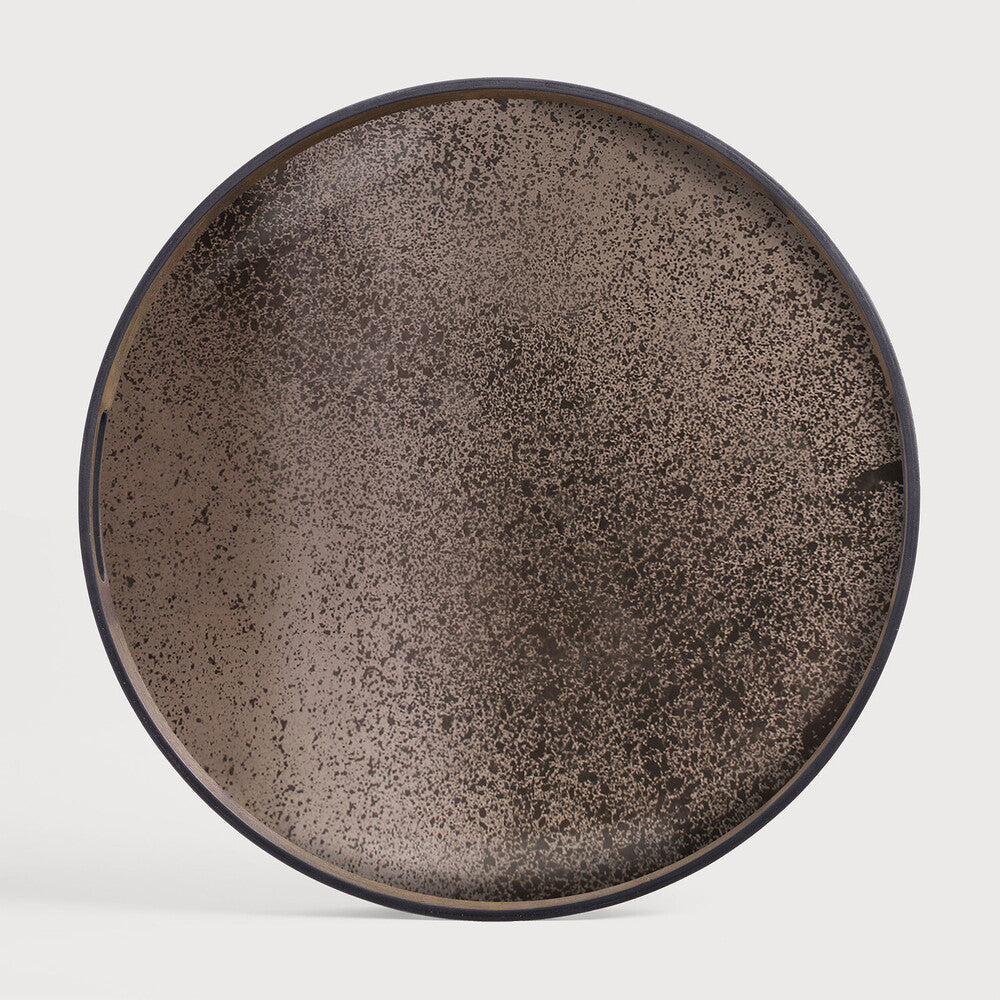 Featuring Bronze Mirror Tray by Ethnicraft at Amethyst Home. A subdued color palette meets captivating motifs inspired by nature and travel. This bronze mirror tray experiments with the balance between rich patterns offset with muted tones, revealing the beauty behind the deceivingly ordinary subjects from which inspiration is drawn. In doing so, this collection captures the essence of timel. Amethyst Home provides interior design services, furniture, rugs, and lighting in the Monterey metro area.