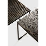 Featuring Pentagon Nesting Coffee Table Set Whisky by Ethnicraft at Amethyst Home. Relying on some of the oldest artistic ancestral techniques, the Pentagon nesting coffee tables are created and shaped by our skilled artisans. Natural mineral powders and pigments blend to form the table’s whisky color and unique finish. Sold as a set of two, offering maxim. Amethyst Home provides interior design, new home construction design consulting, vintage area rugs, and lighting in the Washington metro area.