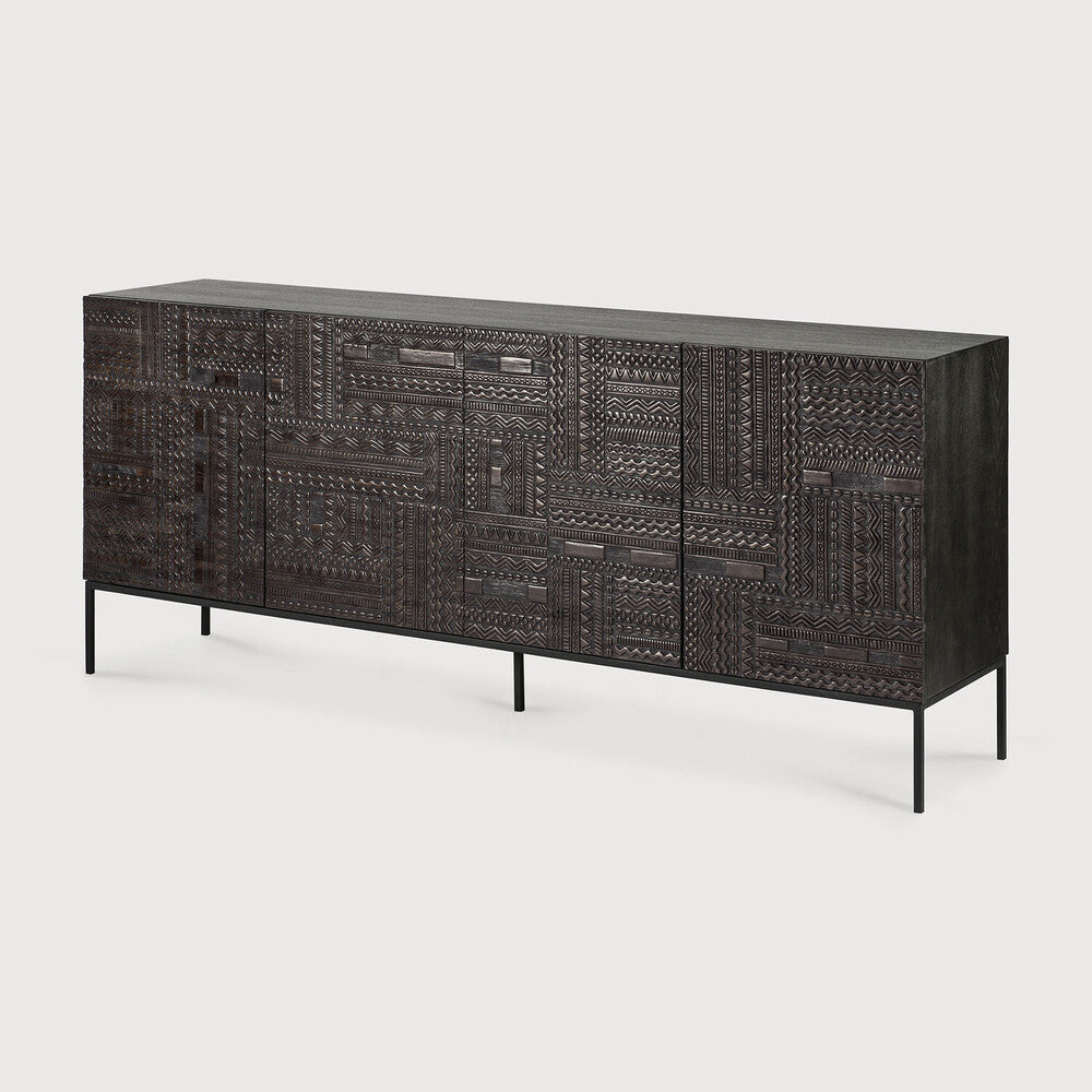 Featuring Tabwa Sideboard Teak Black by Ethnicraft at Amethyst Home. The Tabwa collection offers timeless centerpieces of minimalistic silhouette with a unique and distinct character. Contemporary wooden furniture are transformed into unique pieces of art where each pattern is carefully carved by our artisans. Named after the Tabwa culture from Central Africa, . Amethyst Home provides interior design, new home construction design consulting, vintage area rugs, and lighting in the Omaha metro area.