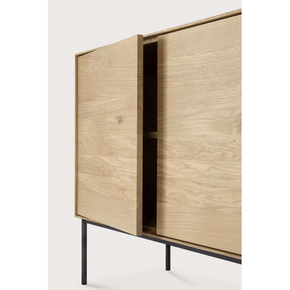 Featuring Whitebird Sideboard Oak by Ethnicraft at Amethyst Home. For our Whitebird collection, designer Alain van Havre brings together opposing elements, combining soft round legs and eye-catching graphic lines into light and airy designs.
Dimensions: 18"d x 59.5"w x 33.5"h
Adjustable Shelves : YesAnti-tipping mechanism : YesFinish : VarnishedMain Material :. Amethyst Home provides interior design, new home construction design consulting, vintage area rugs, and lighting in the Dallas metro area.