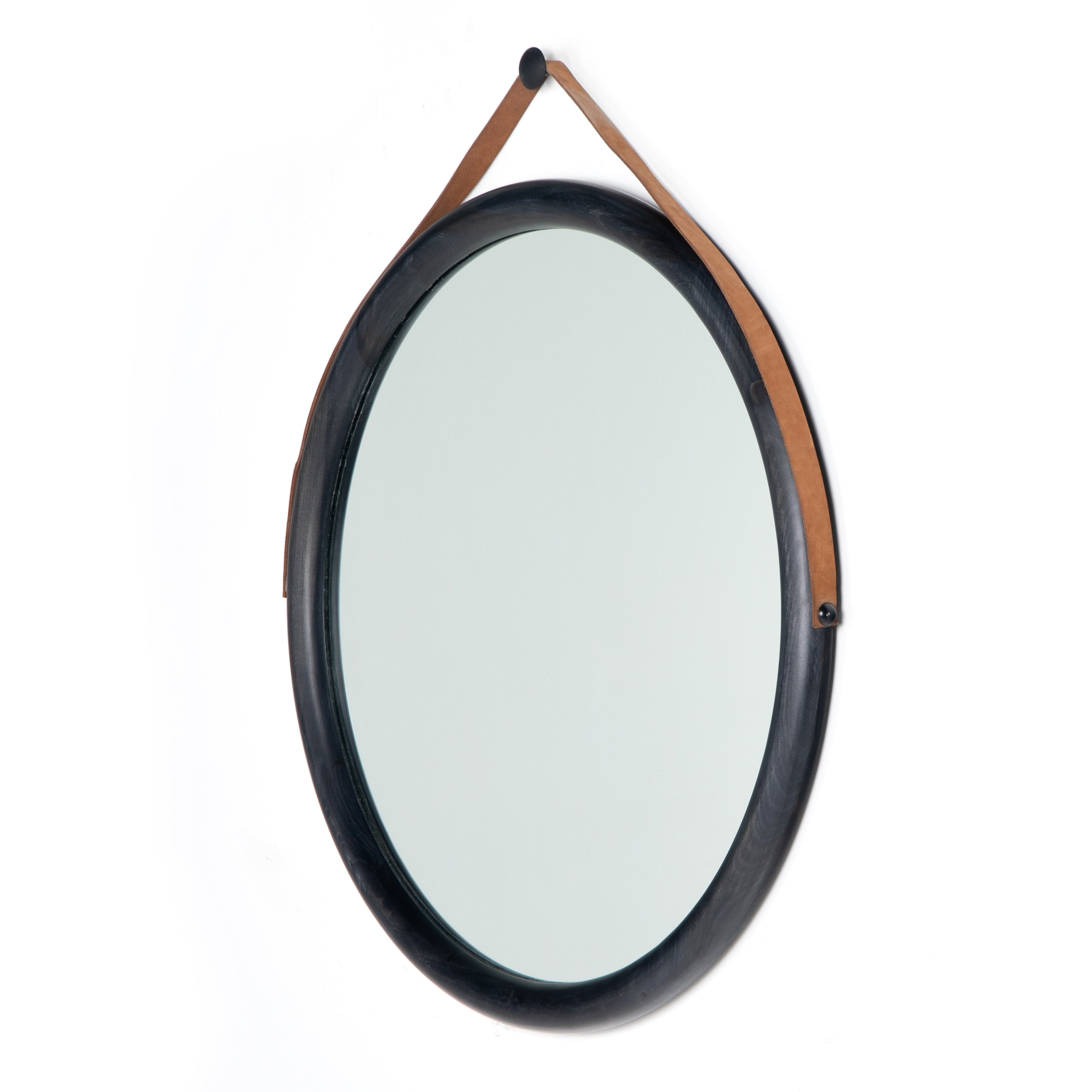 Featuring Des Mirror by Four Hands at Amethyst Home. The Des Mirror is hung by a handsome, toffee-colored top grain leather strap. We love the fresh take on what would otherwise be a traditional, round mirror. The mirror is framed in black-washed popular and would like amazing hung in an entryway, bedroom, or other space. 
Overall Dimensions: 30"W x 1.50"L x 3.  Amethyst Home provides interior design, new home construction design consulting, vintage area rugs, and lighting in the Miami metro area.