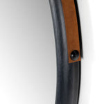 Featuring Des Mirror by Four Hands at Amethyst Home. The Des Mirror is hung by a handsome, toffee-colored top grain leather strap. We love the fresh take on what would otherwise be a traditional, round mirror. The mirror is framed in black-washed popular and would like amazing hung in an entryway, bedroom, or other space. 
Overall Dimensions: 30"W x 1..  Amethyst Home provides interior design, new home construction design consulting, vintage area rugs, and lighting in the Winter Garden metro area.