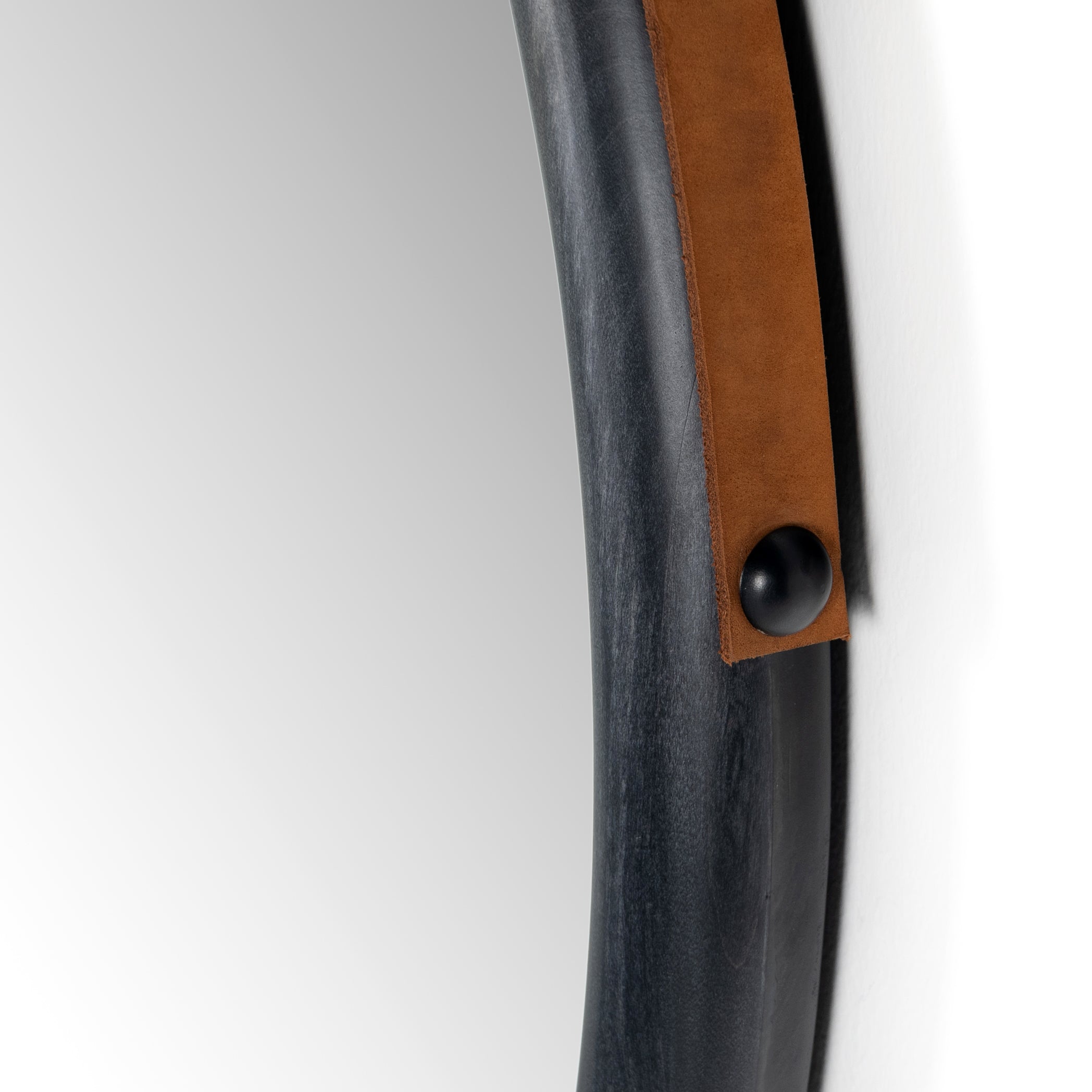 Featuring Des Mirror by Four Hands at Amethyst Home. The Des Mirror is hung by a handsome, toffee-colored top grain leather strap. We love the fresh take on what would otherwise be a traditional, round mirror. The mirror is framed in black-washed popular and would like amazing hung in an entryway, bedroom, or other space. 
Overall Dimensions: 30"W x 1..  Amethyst Home provides interior design, new home construction design consulting, vintage area rugs, and lighting in the Winter Garden metro area.