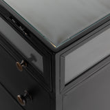 Featuring Shadow Box Nightstand by Four Hands at Amethyst Home. This Shadow Box Nightstand is finished in a gorgeous matte black. We love that the glass top allows you to showcase your favorite jewelry or family keepsake, while the two spacious drawers give you storage space. The knobs are finished in bronze to give this piece a sleek contrast. 
Overall Dimens.  Amethyst Home provides interior design, new home construction design consulting, vintage area rugs, and lighting in the Omaha metro area.