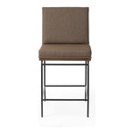 Featuring Crete Fiqa Boucle Cocoa Stool by Four Hands at Amethyst Home. Crisp and clean, with natural panache. Slim, black-finished iron frames a floating ladderback of solid oak. Upholstered in a Fiqa boucle textile, the next generation of performance fabric. Easy to clean and made from fully recyclable materials, Fiqa fabrics are machine-washable, stain-resis. Amethyst Home provides interior design, new home construction design consulting, vintage area rugs, and lighting in the Tampa metro area.