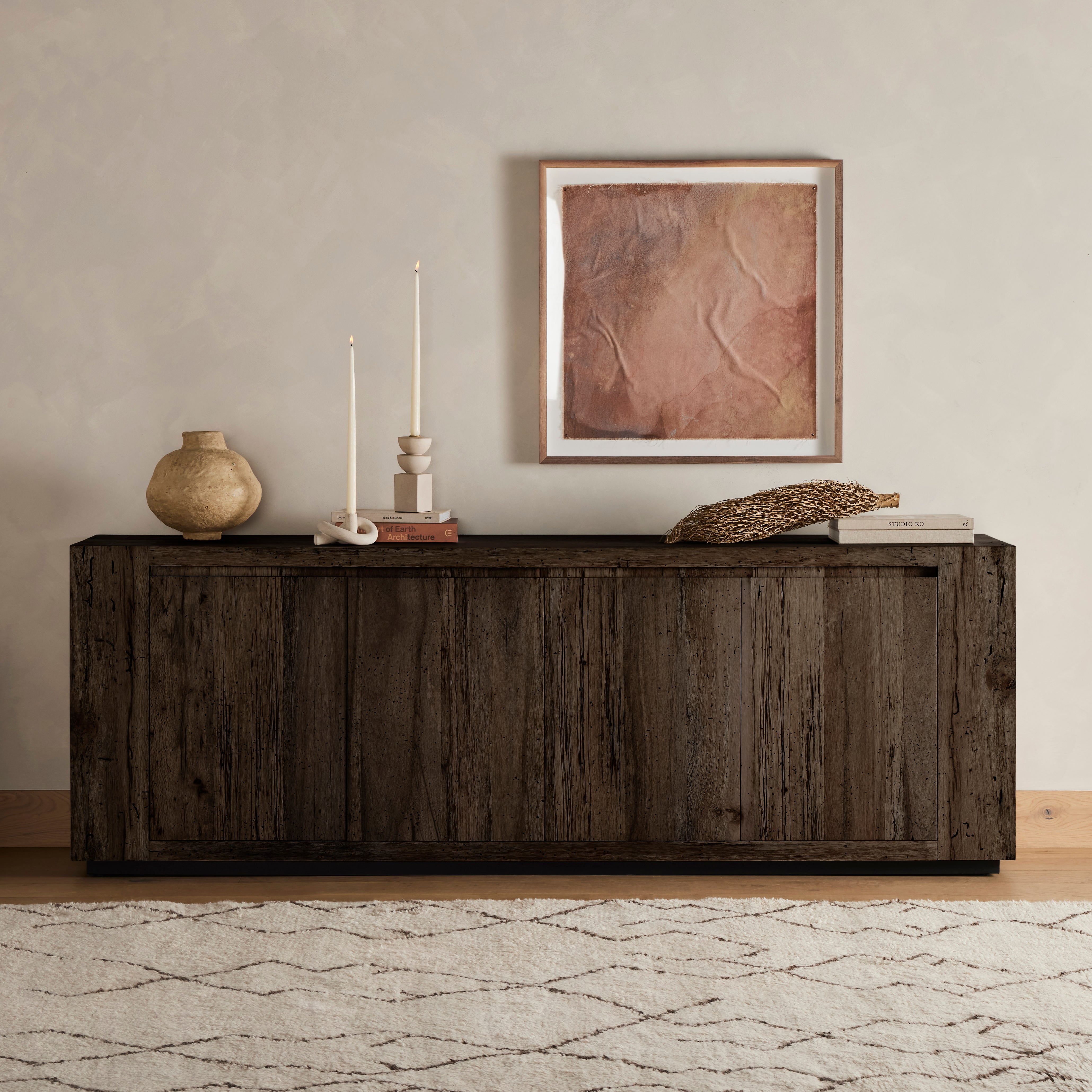 Featuring Abaso Ebony Rustic Wormwood Oak Sideboard by Four Hands at Amethyst Home. Made from thick-cut oak veneer with a faux rustic finish made to emulate wormwood, this low, large-scale sideboard features chunky squared legs and dovetail joinery detailing.Overall Dimensions: 94.50"W x 19.75"L x 33.25"HColors: Black Mdf, Rustic Wormwood Oak, Black PlywoodMat. Amethyst Home provides interior design, new home construction design consulting, vintage area rugs, and lighting in the Boston metro area.
